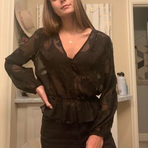 Sheer black with flowers blouse.